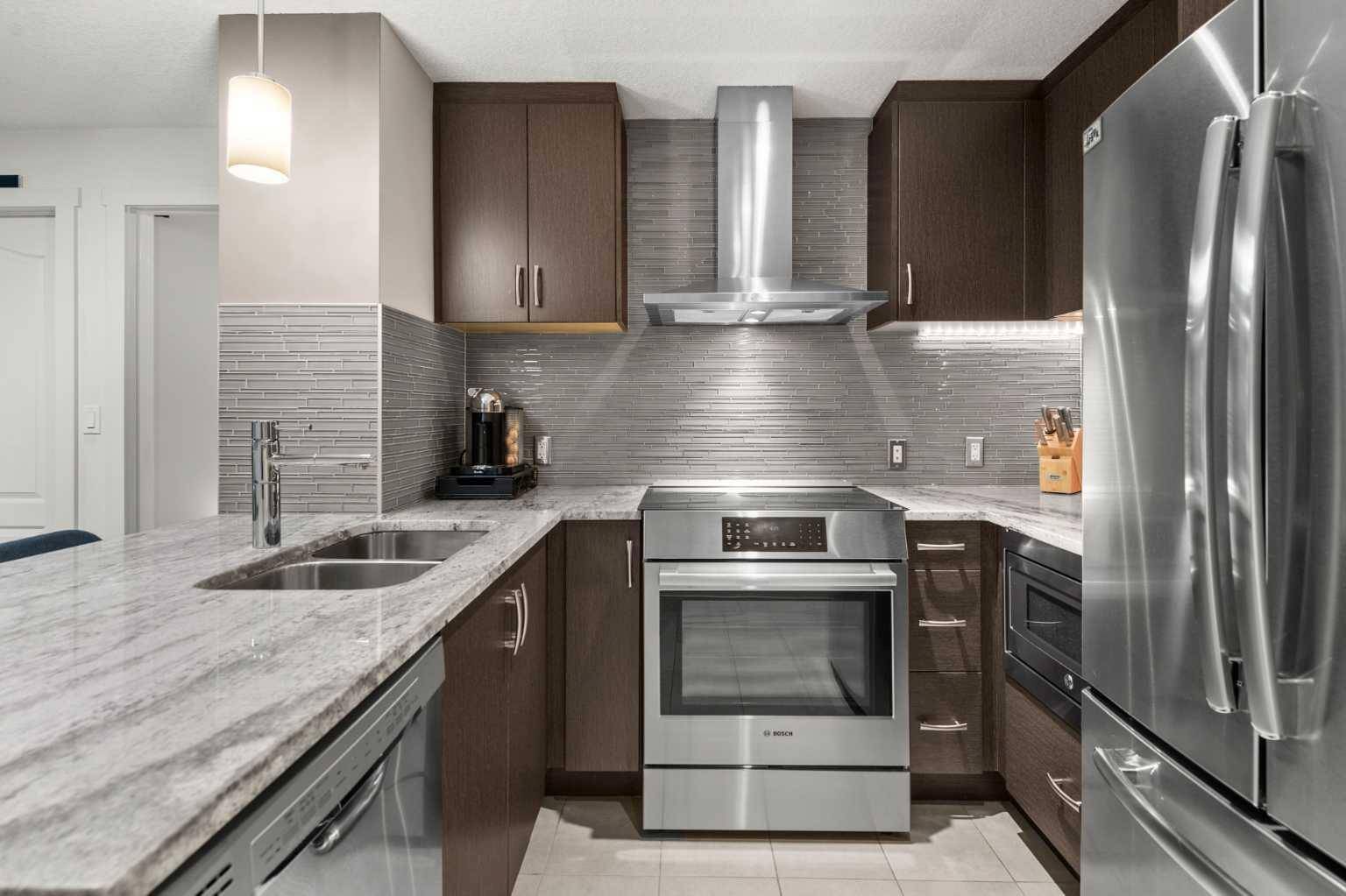 Calgary, AB T2R 0Y9,303 13 AVE SW #201