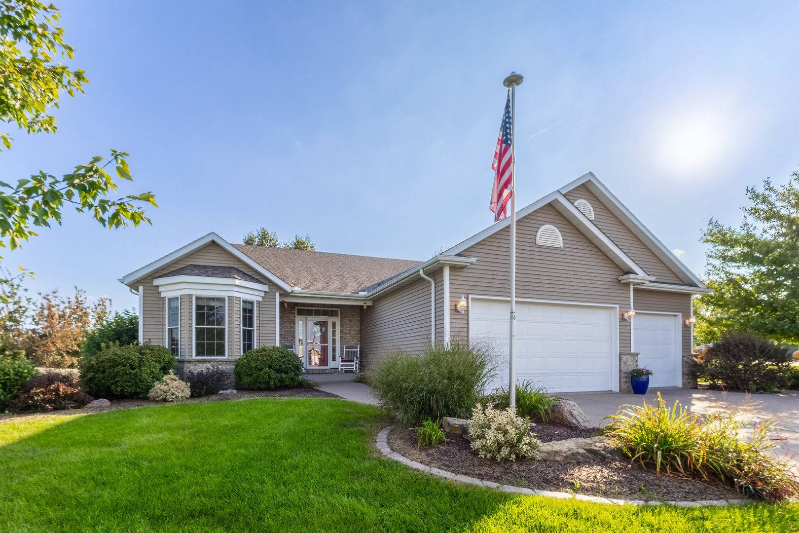 414 Fenceline DR, Blue Grass, IA 52726